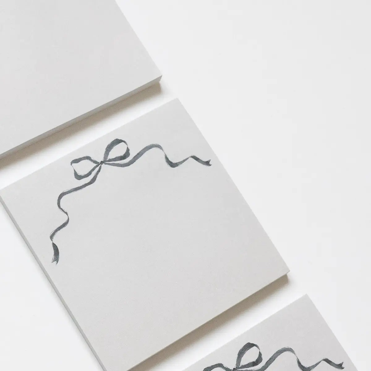 black bow sticky note pad