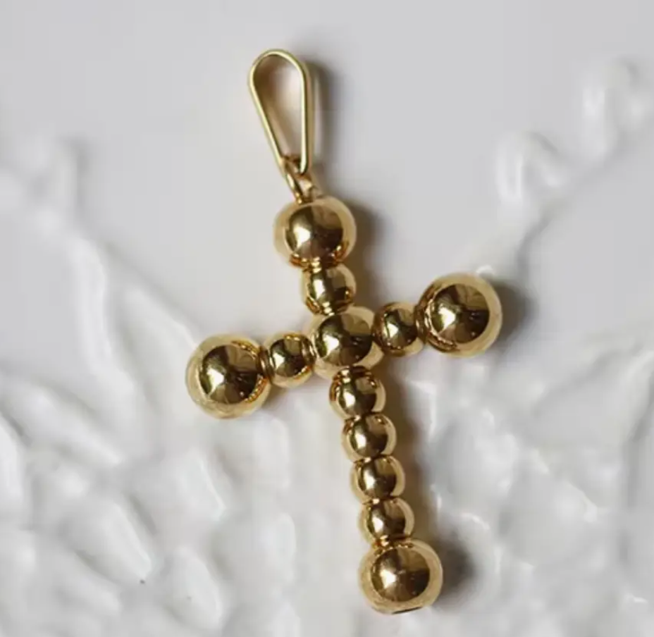 gold beaded cross charm