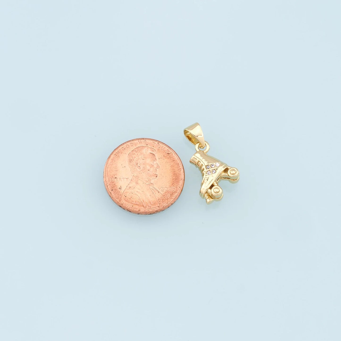 gold roller skate charm